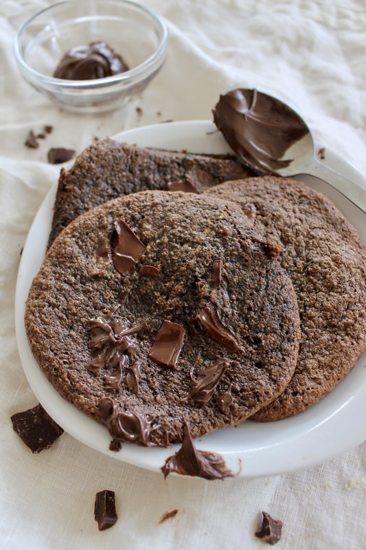 Double Chocolate Hazelnut Nutella Cookies- Grain-free & Dairy-free. A heavenly mix between a cookie, a brownie, and nutella. #paleo #paleotreats #grainfree #dairyfree #glutenfree #glutenfreedesserts #cookies #nutella #chocolate #chocolatecookies #nutellacookies #healthydessert